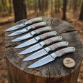 Handmade Artisan Bushcraft Knife Set of 7-Piece Full Tang Set with Bone Handles & Orange Spacers