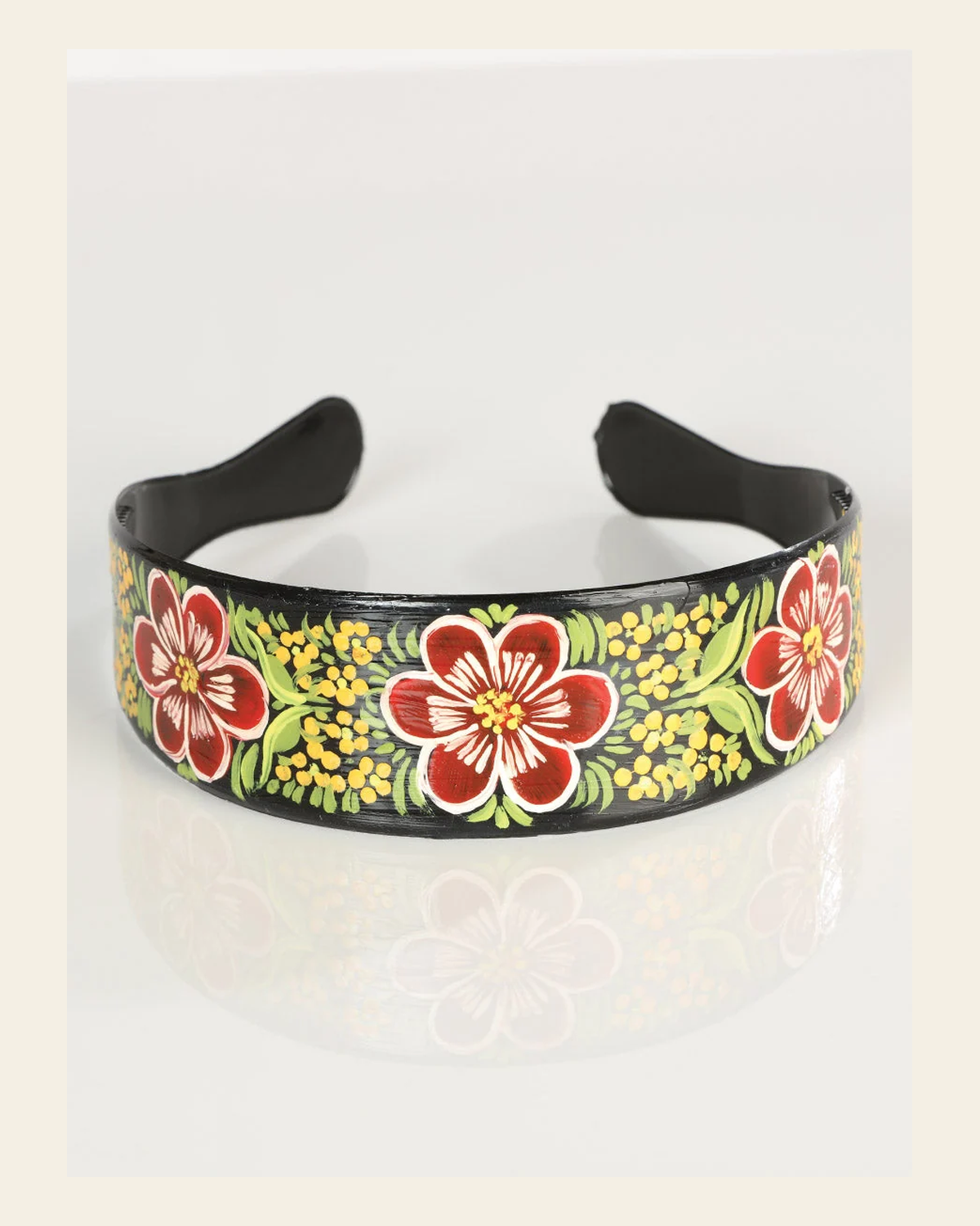 Artisanal Hand-Painted Headband Plastic Multicolor 602937 on a warm cream background