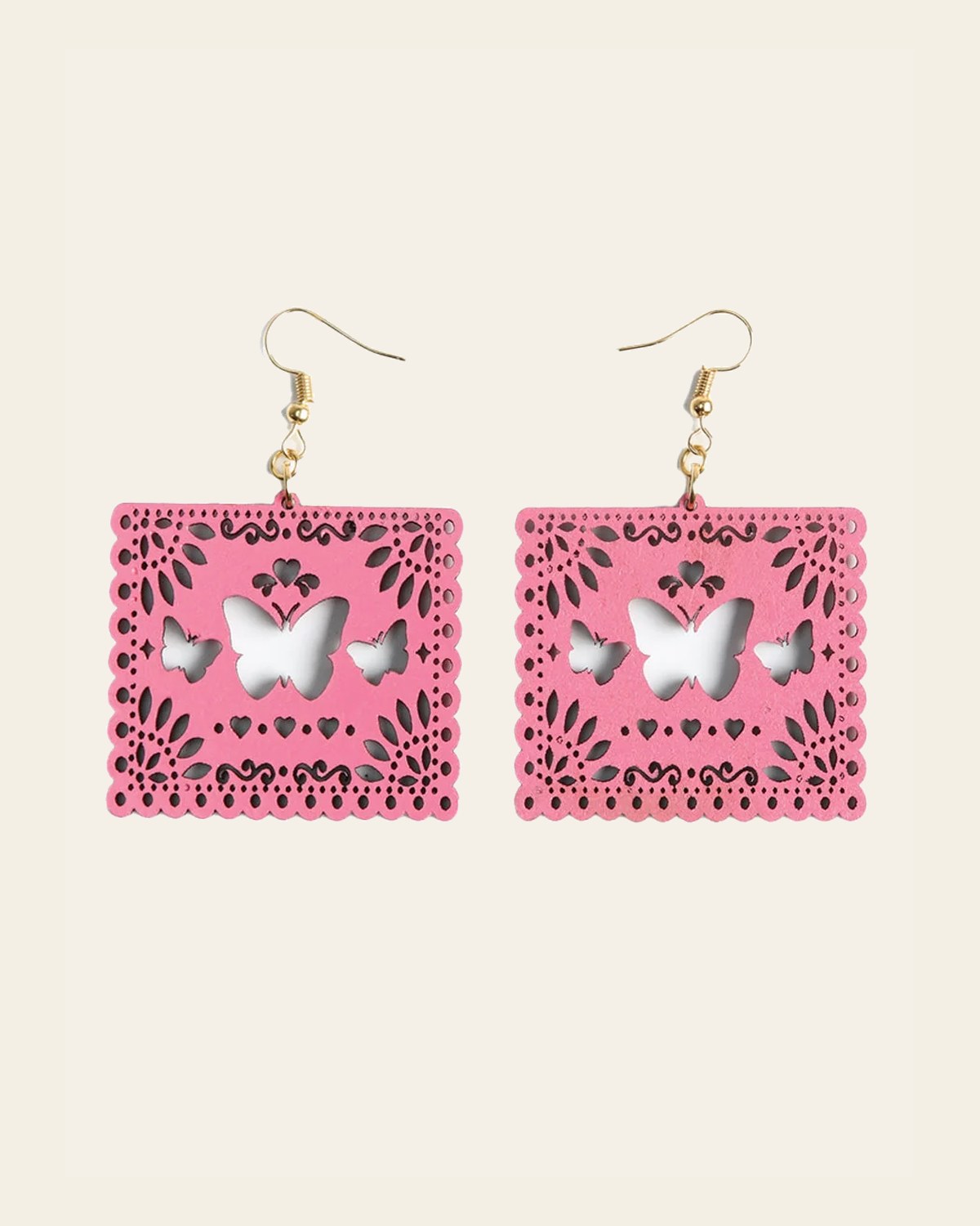 Artisanal Handmade Earrings Wood Pink 603946 on a warm cream background