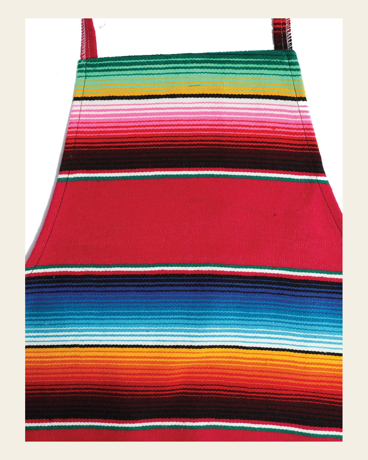 Artisanal Mexican Zarape Apron 100% Acrylan Fuchsia 603581 on a warm cream background