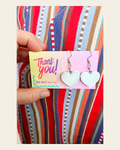 Bag of 20 -Boutique 3d Printed Package Inserts Heart Dangle Earrings Made in America on a warm cream background