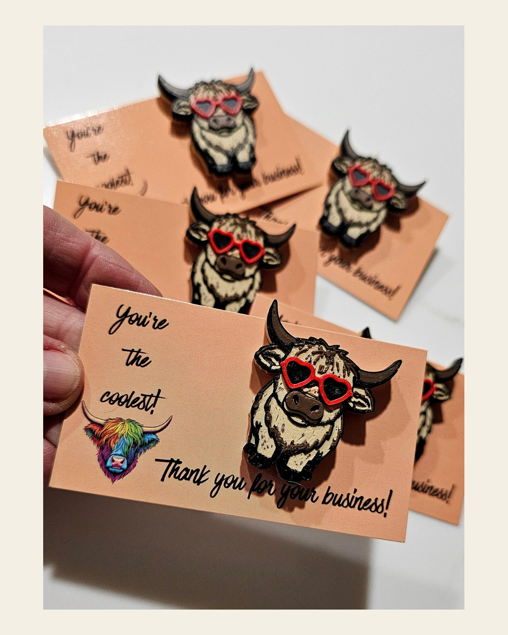 Bag of 25 -Boutique 3d Printed Package Inserts Cool Highland Cow Hat Pin Made in America on a warm cream background