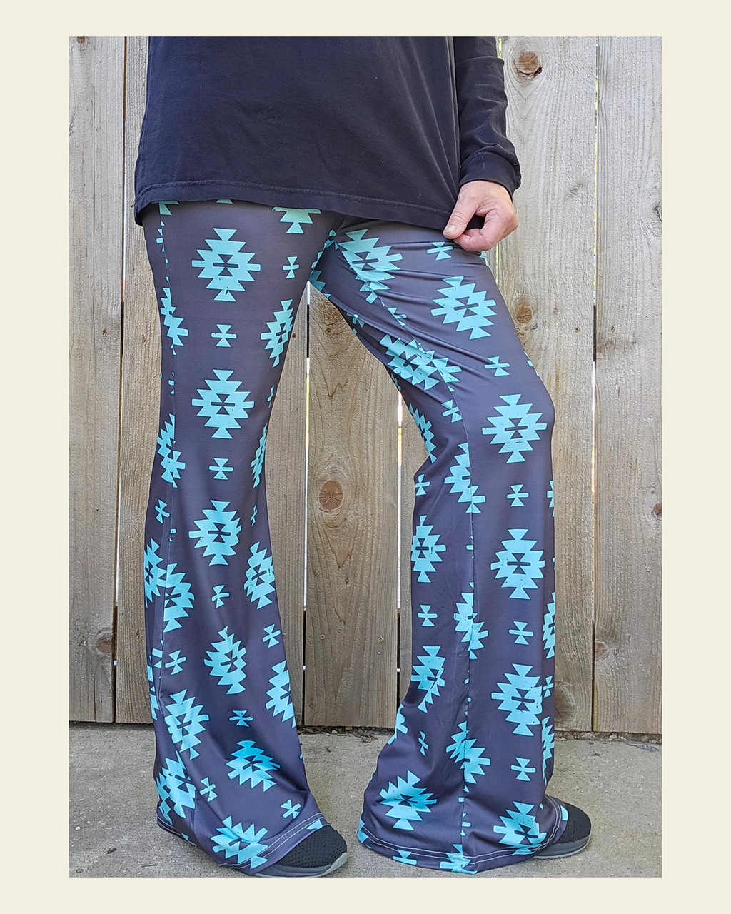 Baha Ranch Charcoal Turquoise Aztec Flare Pants on a warm cream background