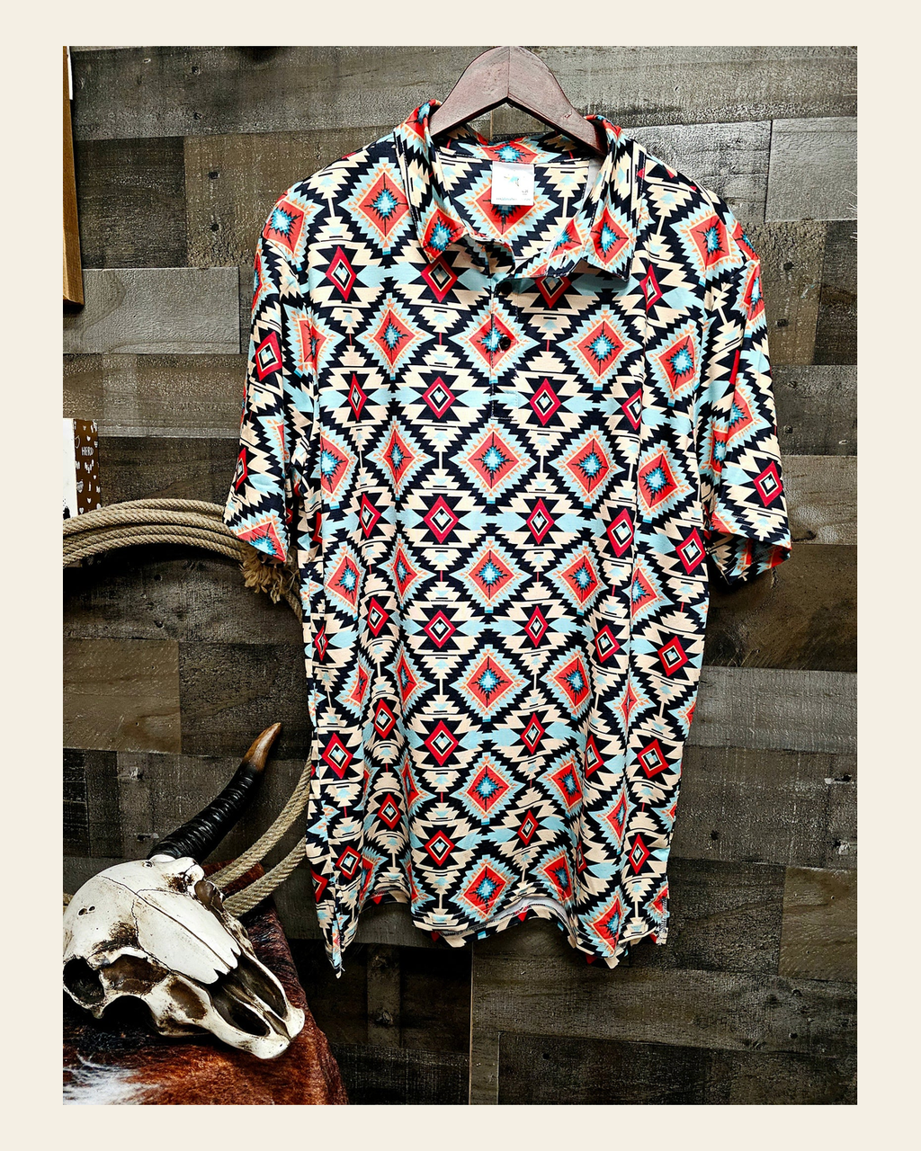 Baha Ranch Colorado Aztec Men's Western Polo Shirt on a warm cream background