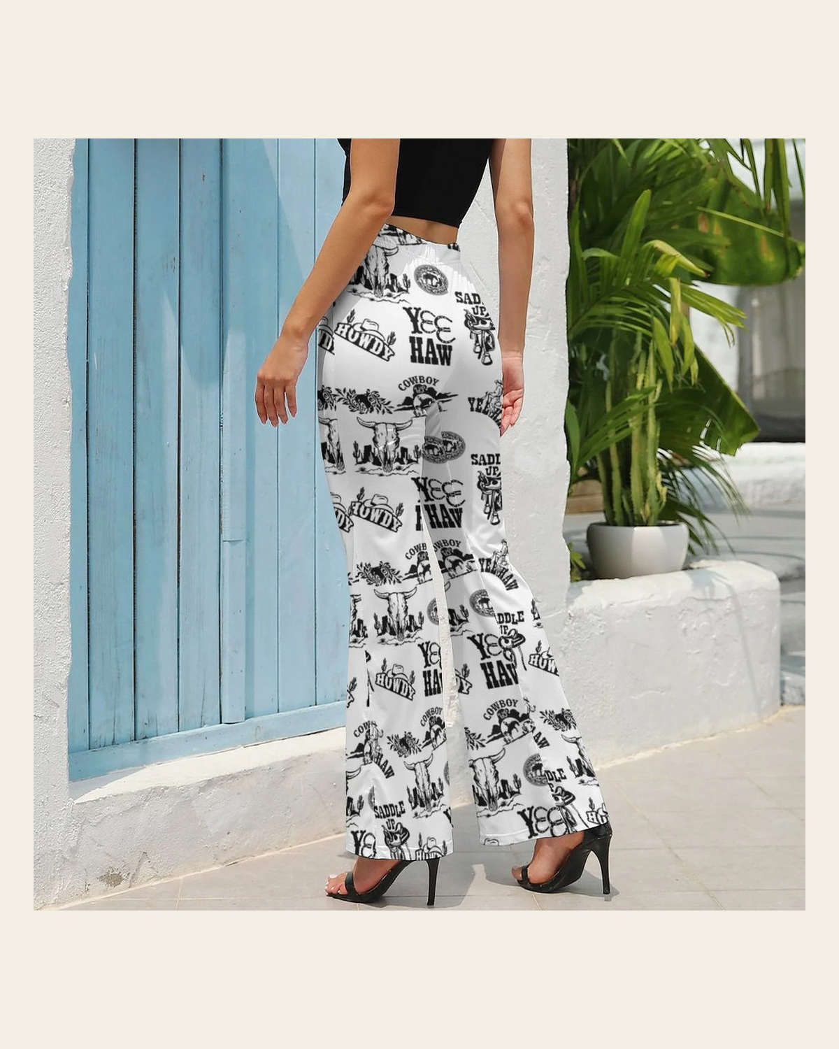 Baha Ranch Cowboy Print Western Flare Pants on a warm cream background