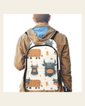 Baha Ranch Hairy Highland Backpack on a warm cream background