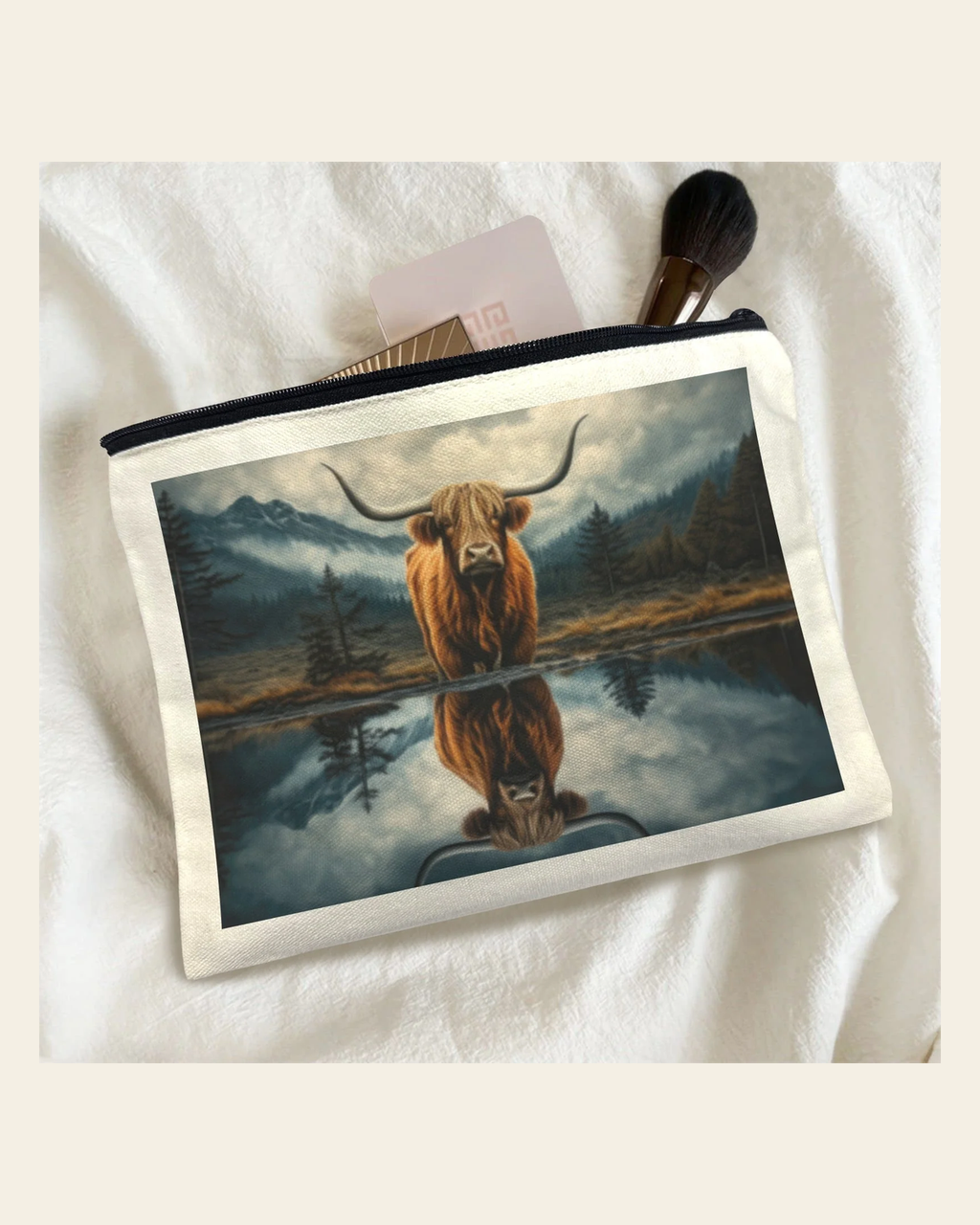 Baha Ranch Reflection Highland Cow Cosmetic Bag Made in America on a warm cream background