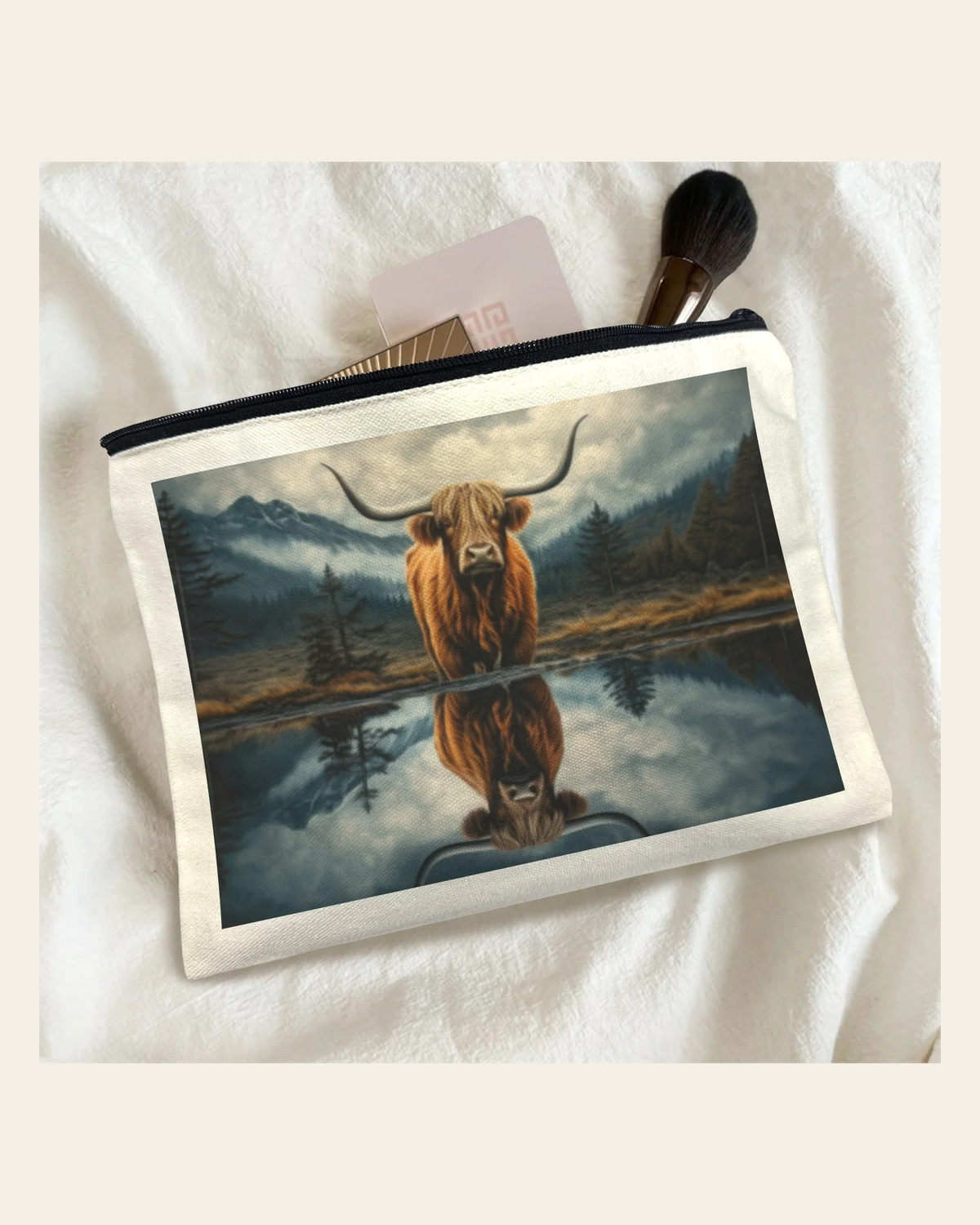 Baha Ranch Reflection Highland Cow Cosmetic Bag Made in America on a warm cream background