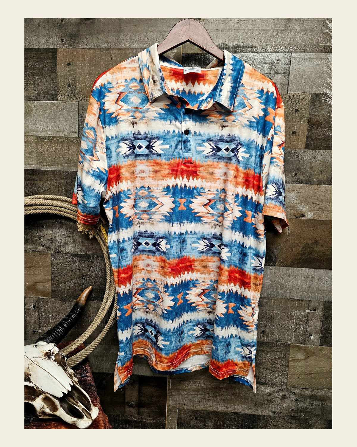 Baha Ranch Southwestern Aztec Men's Polo Shirt on a warm cream background