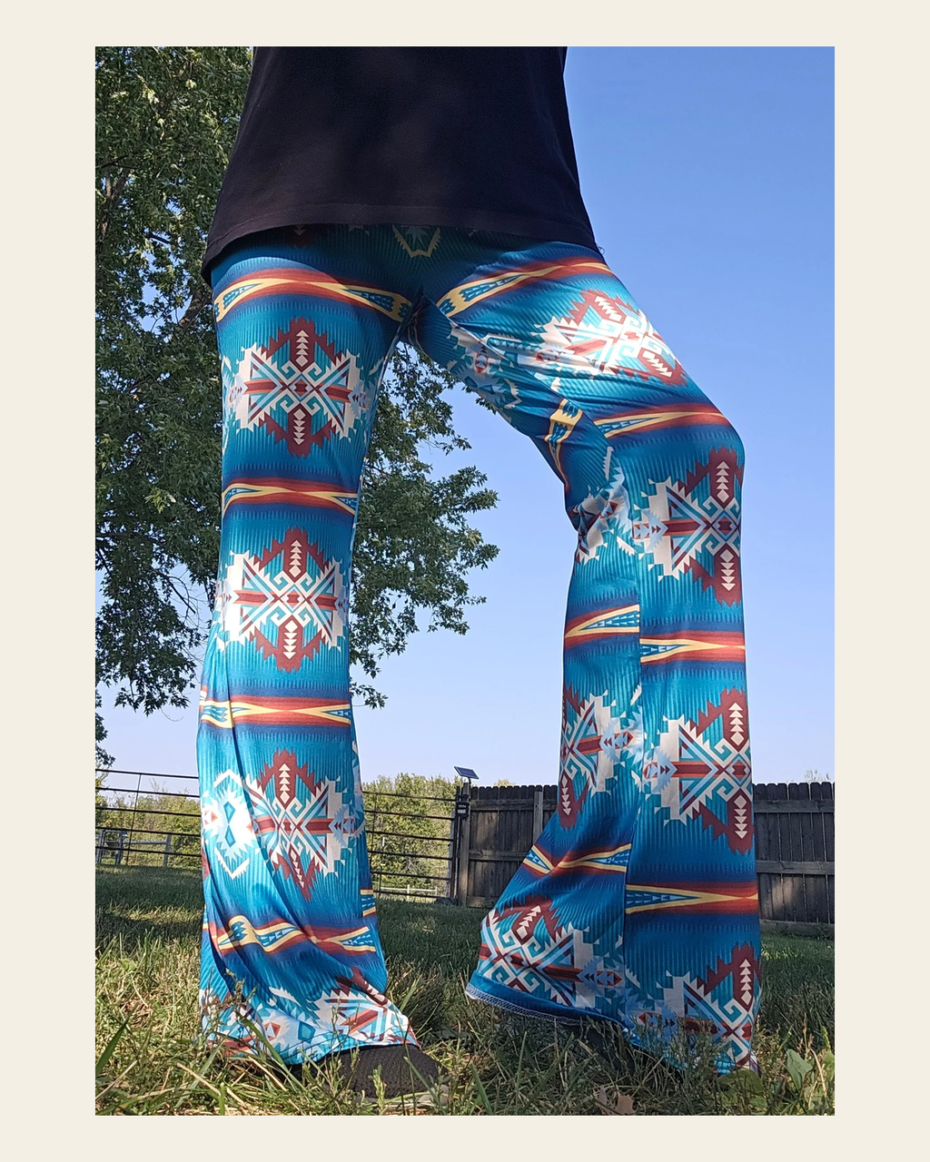 Baha Ranch Teal Aztec Flare Pants on a warm cream background
