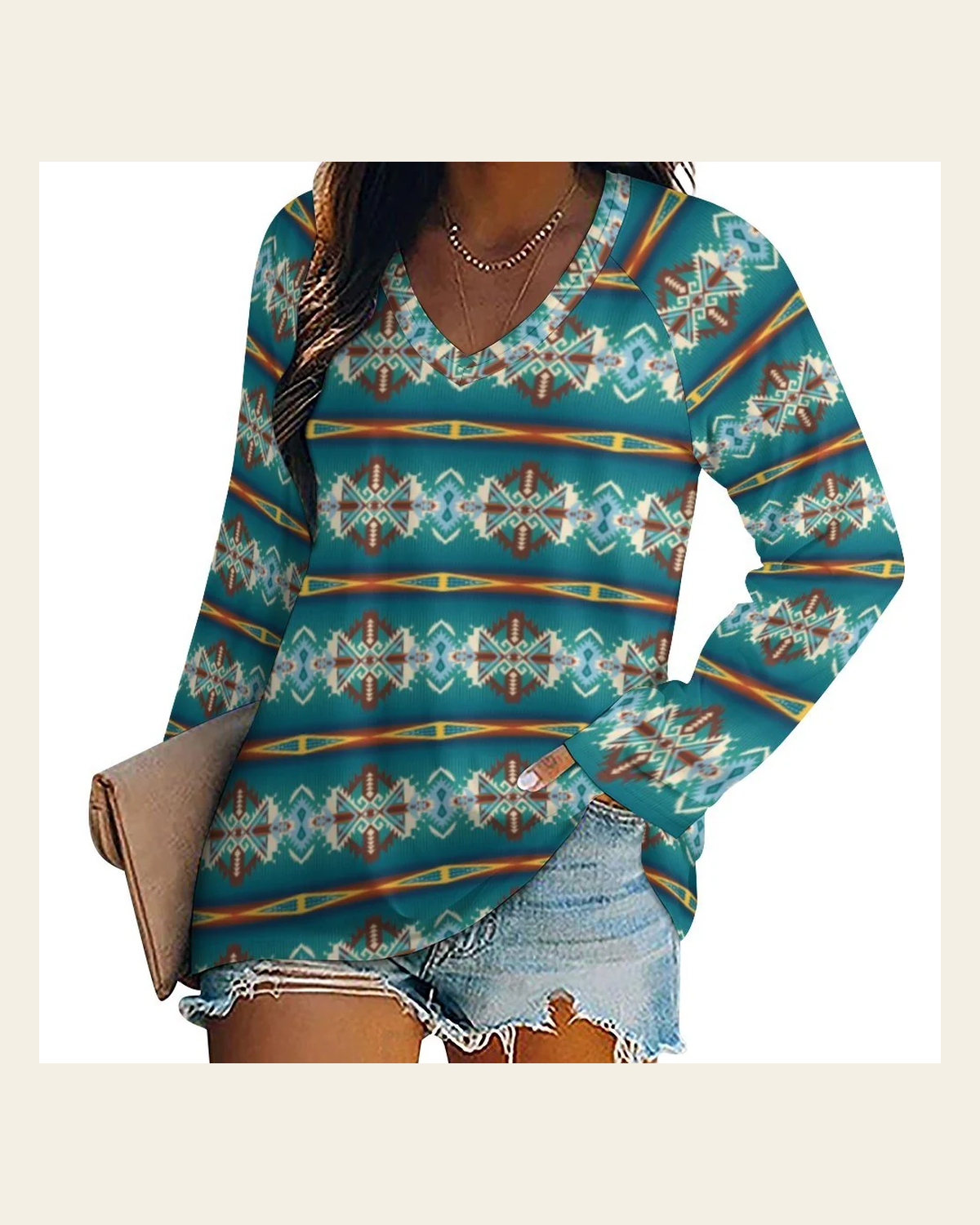 Baha Ranch Teal Aztec Long Sleeve Top on a warm cream background
