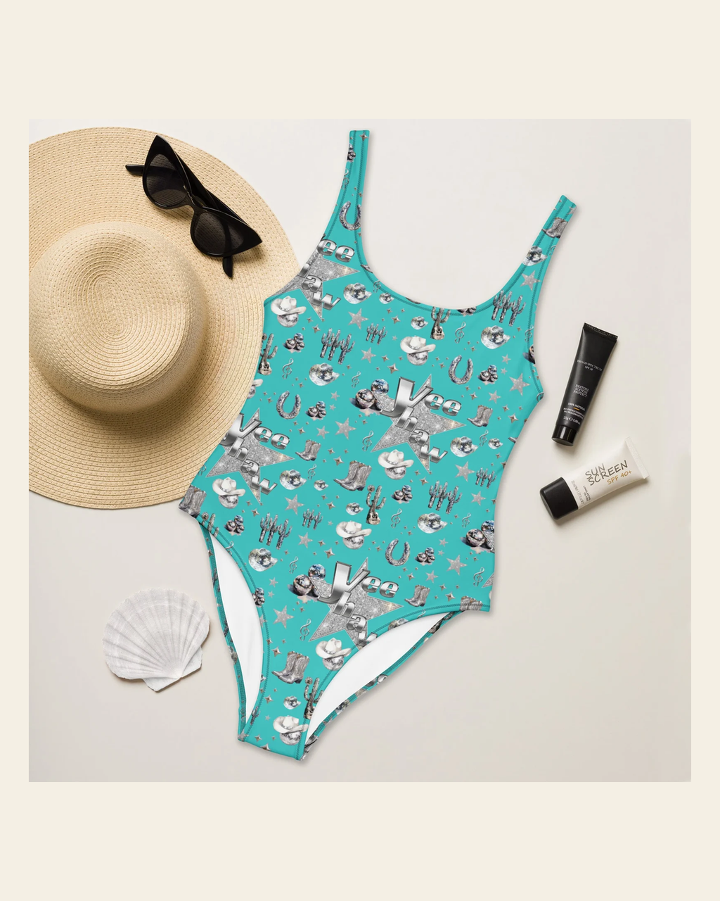 Baha Ranch Yeehaw Rhinestone Cowgirl Turquoise One-Piece Swimsuit on a warm cream background