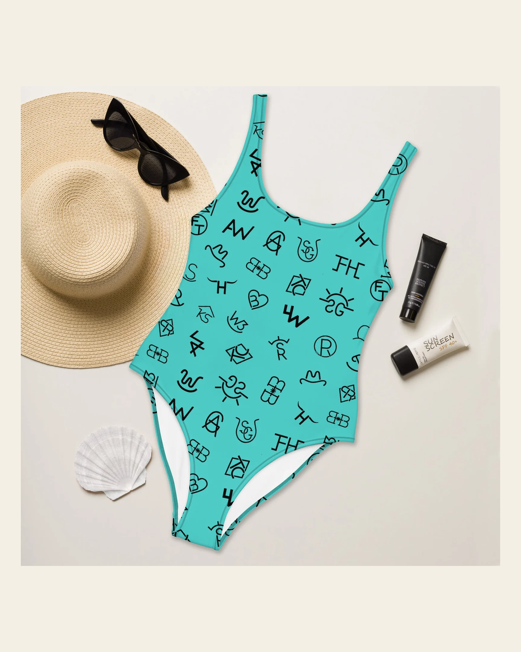 Baha Ranch Yeehaw Turquoise Cattle Brands One-Piece Swimsuit on a warm cream background