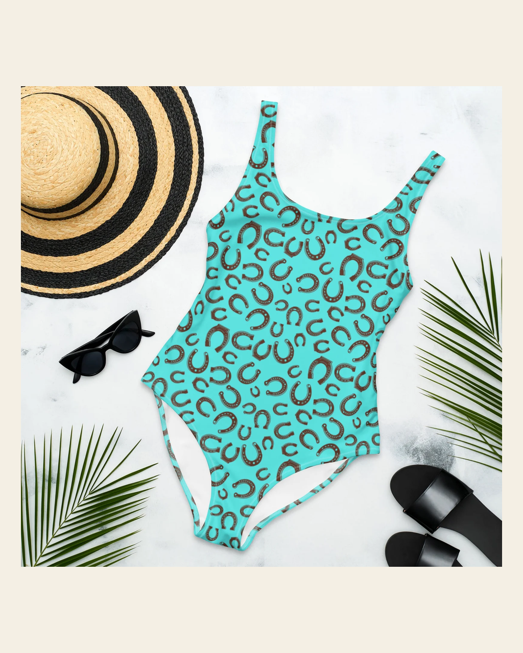 Baha Ranch Yeehaw Turquoise Horseshoe One-Piece Swimsuit on a warm cream background