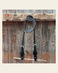 Black Cob - Gag One Ear Headstall / Bridle- Short Cheeks on a warm cream background