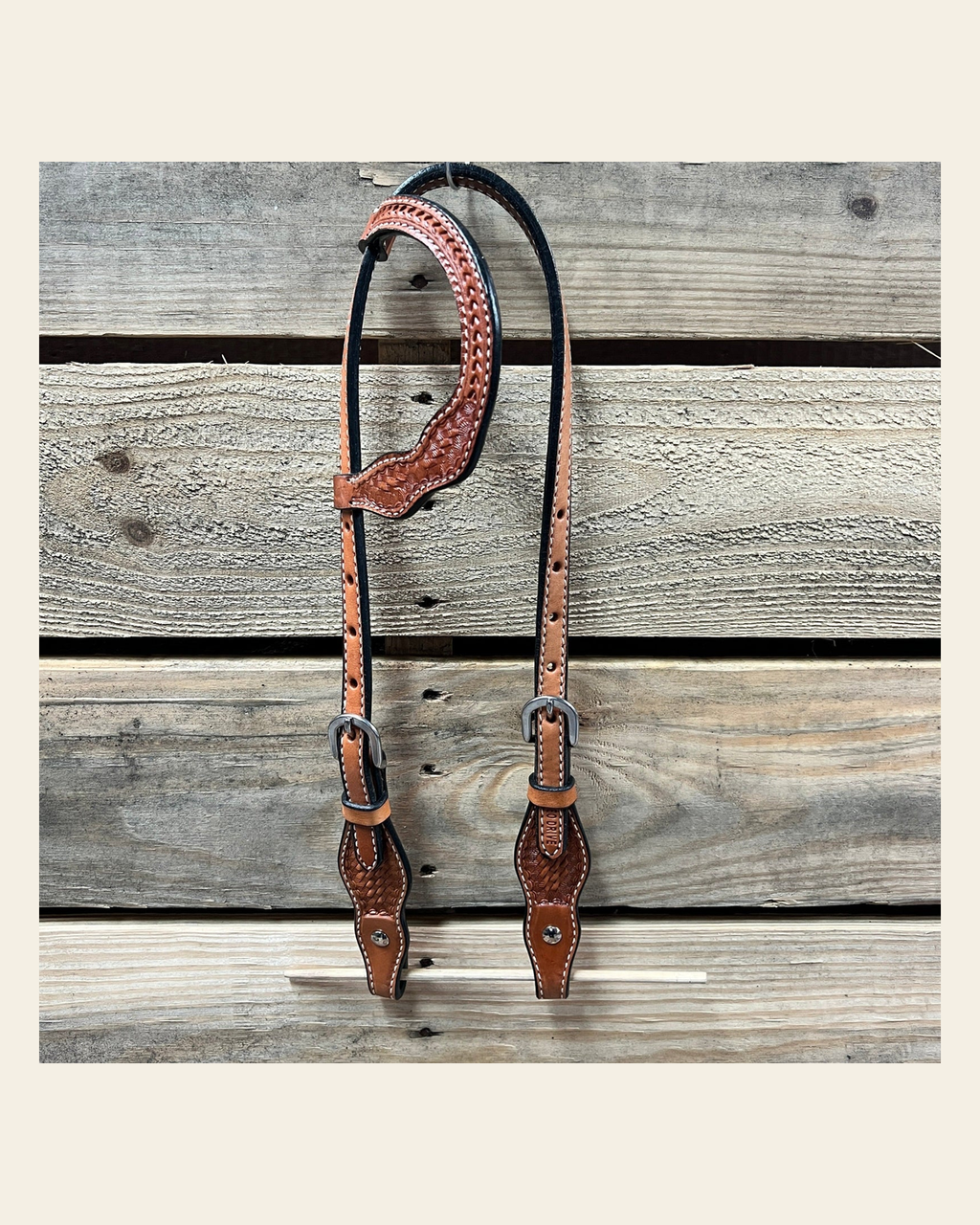 Light Oil Cob - Gag One Ear Headstall / Bridle- Short Cheeks on a warm cream background