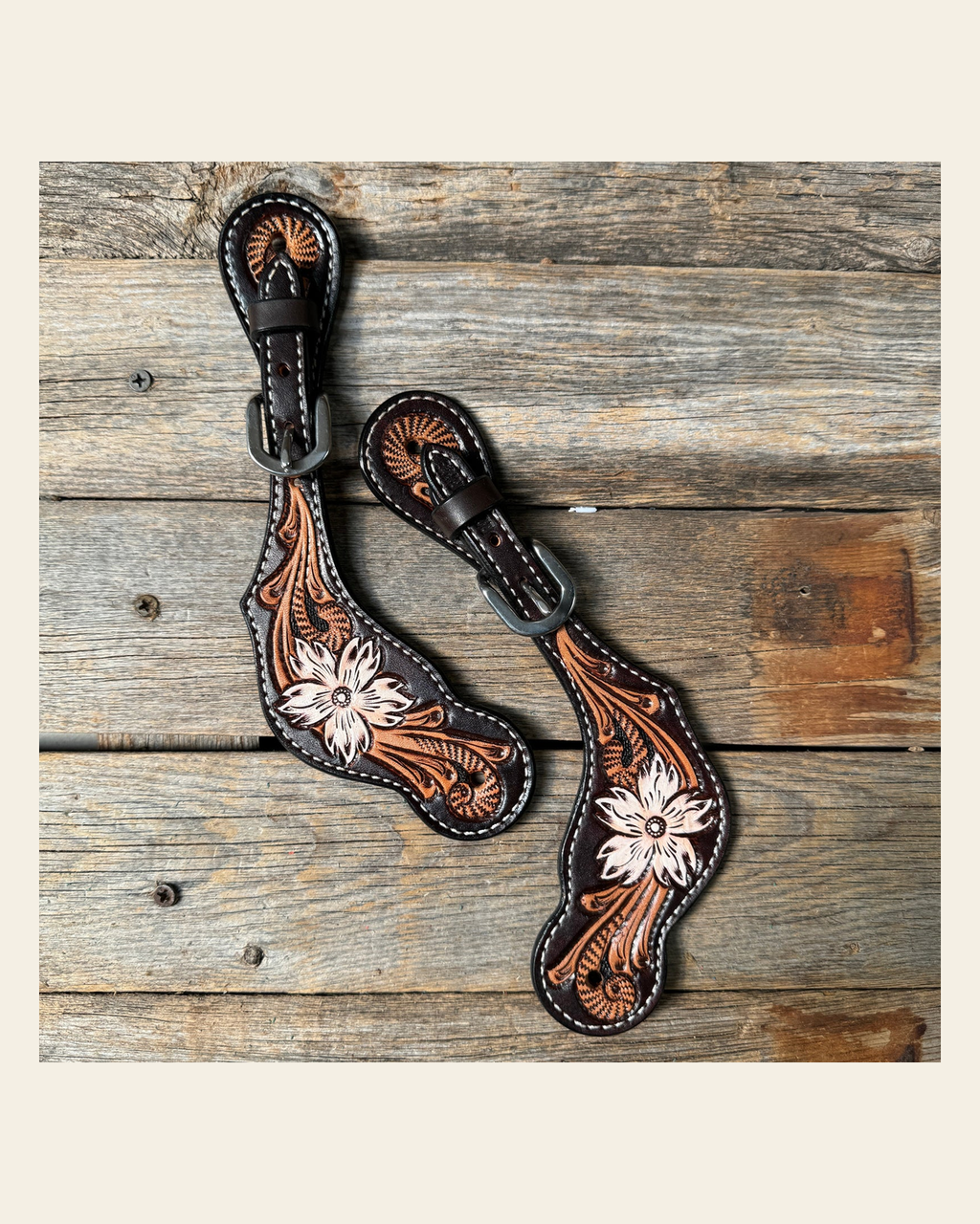 Triple Tone Floral Spur Straps on a warm cream background