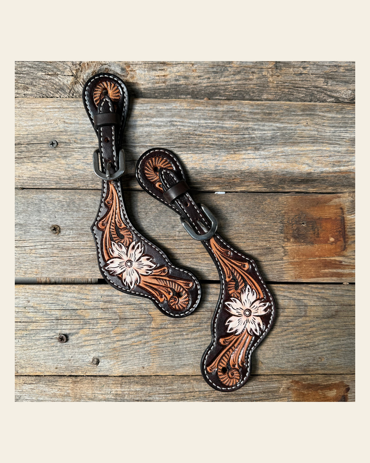 Triple Tone Floral Spur Straps on a warm cream background