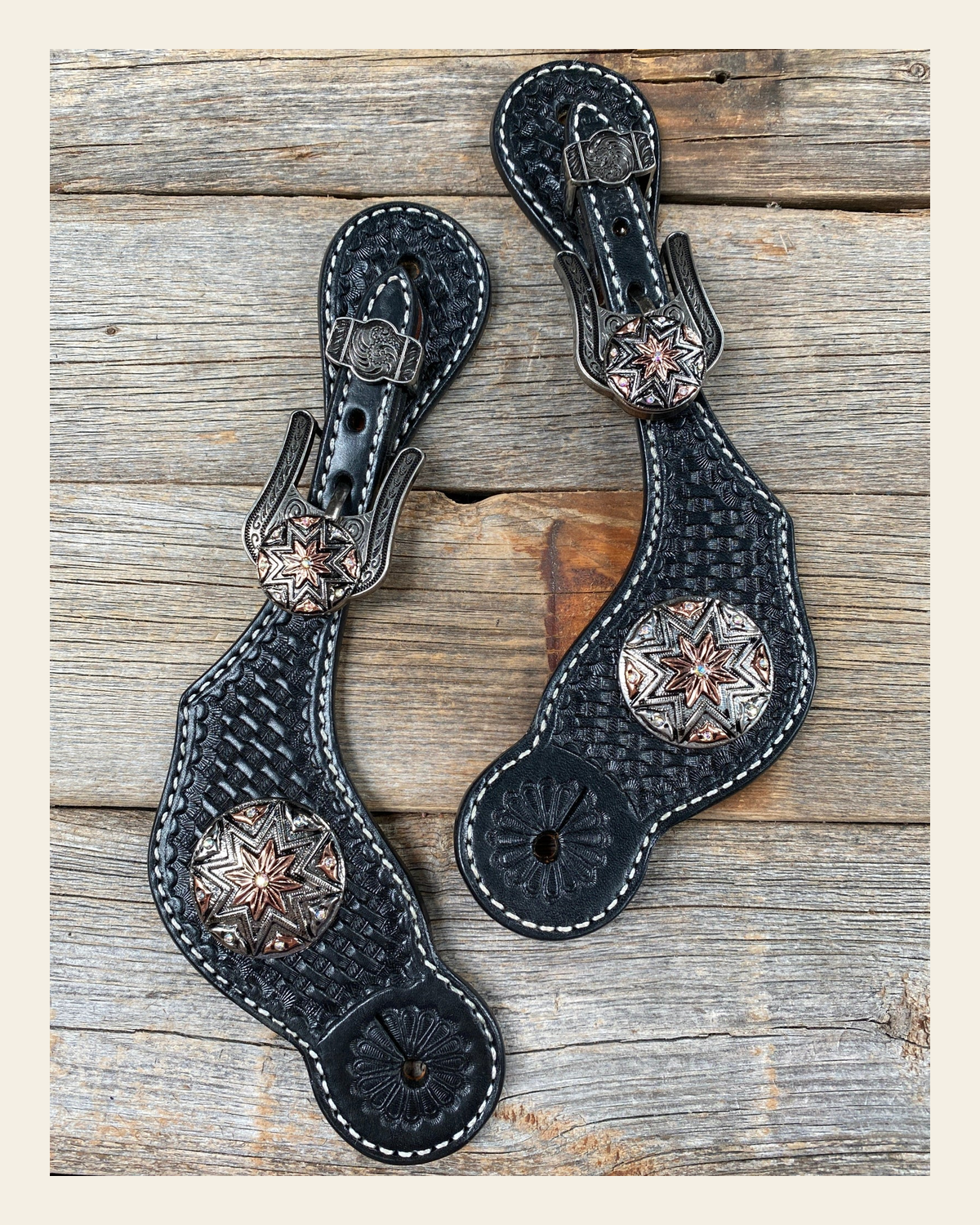 Black Basketweave Spur Straps - Antique Silver Starburst Conchos #SS108 on a warm cream background