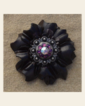 Black Carnation Flower With Antique Silver Amethyst and AB 1" Concho on a warm cream background