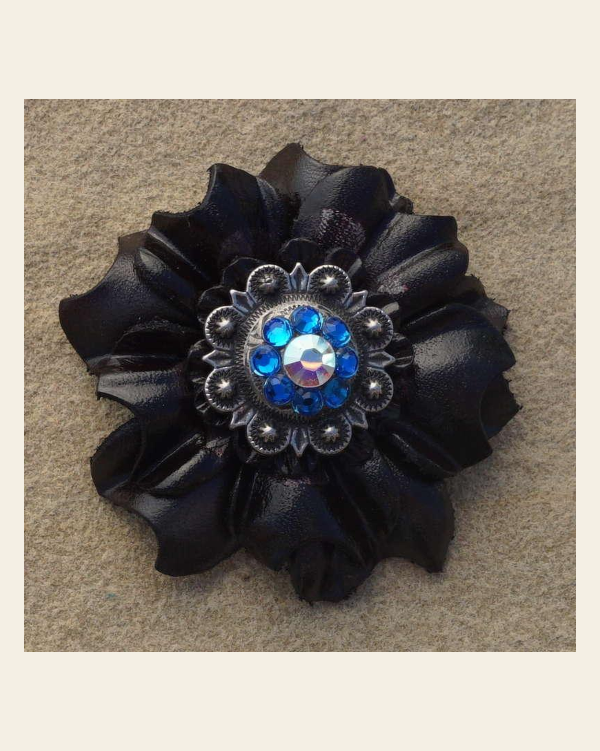 Black Carnation Flower With Antique Silver Capri and AB 1" Concho on a warm cream background