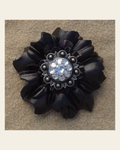 Black Carnation Flower With Antique Silver Clear 1" Concho on a warm cream background