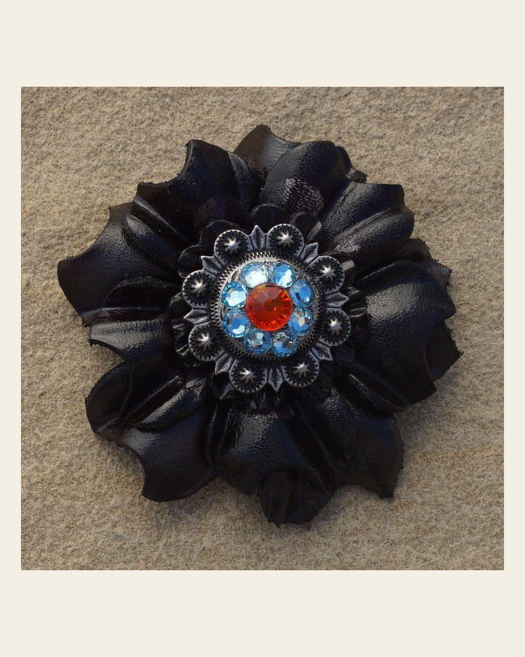 Black Carnation Flower With Antique Silver Fire Opal and Aqua 1" Concho on a warm cream background