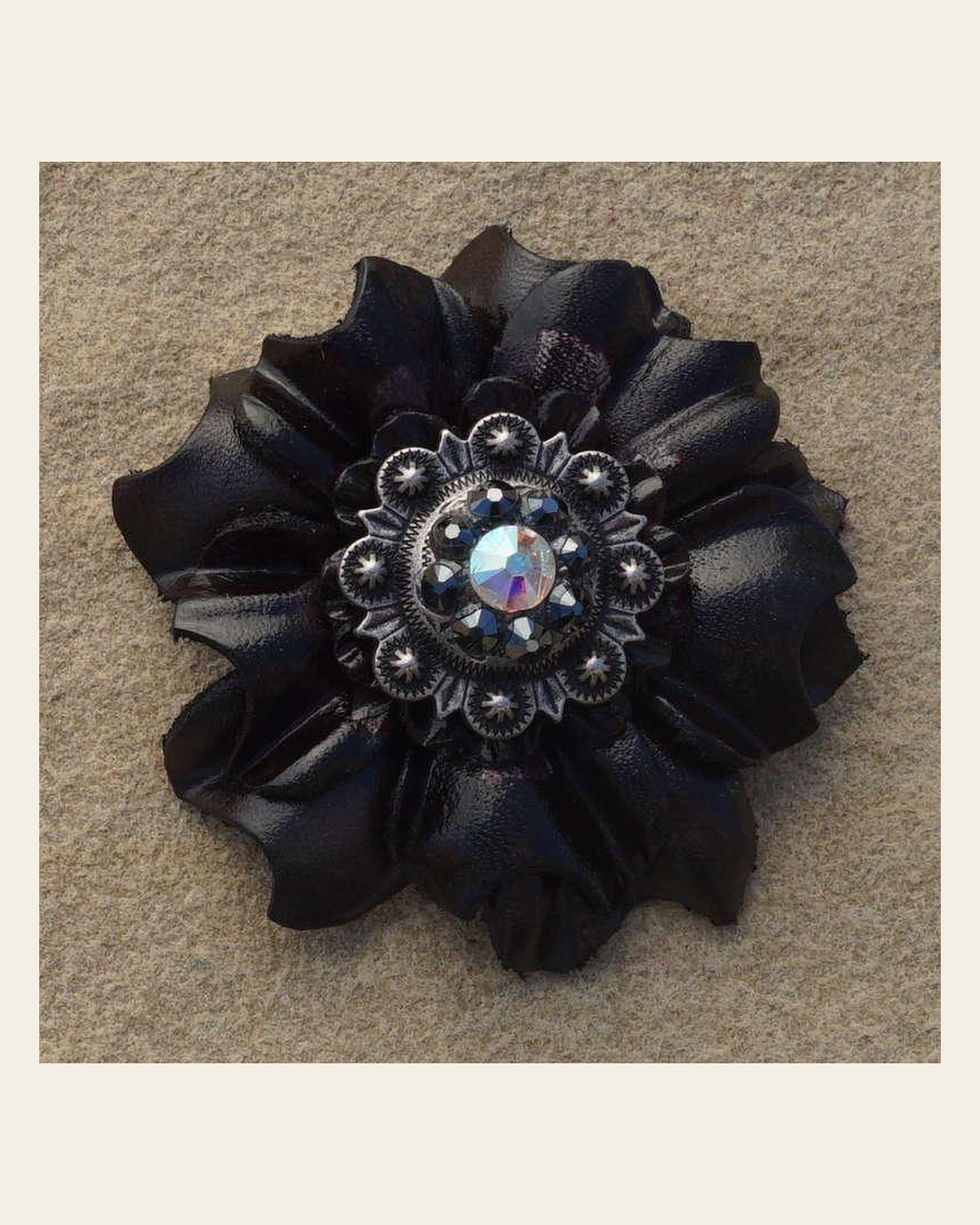 Black Carnation Flower With Antique Silver Jet and AB 1" Concho on a warm cream background