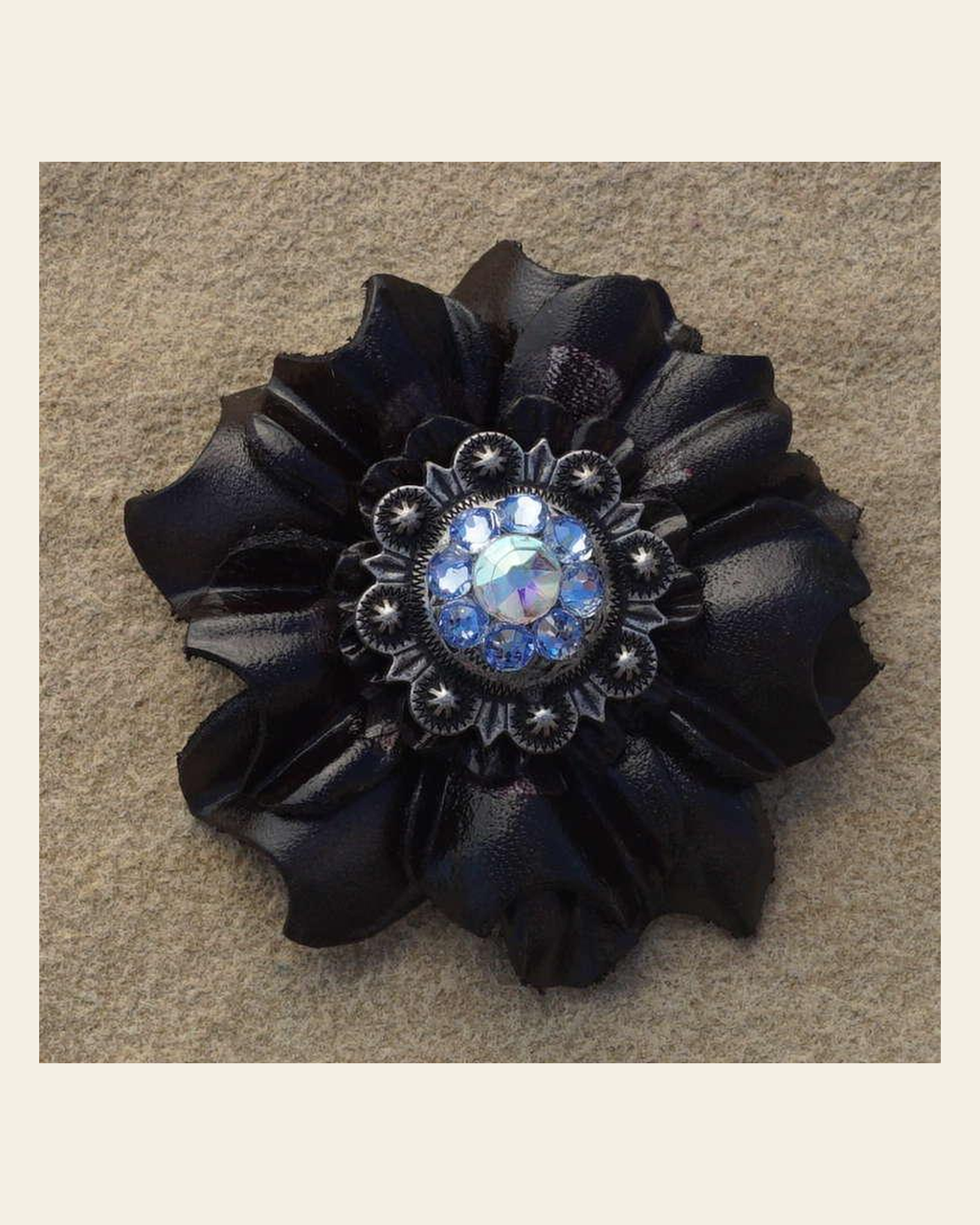 Black Carnation Flower With Antique Silver Light Sapphire and AB 1" Concho on a warm cream background