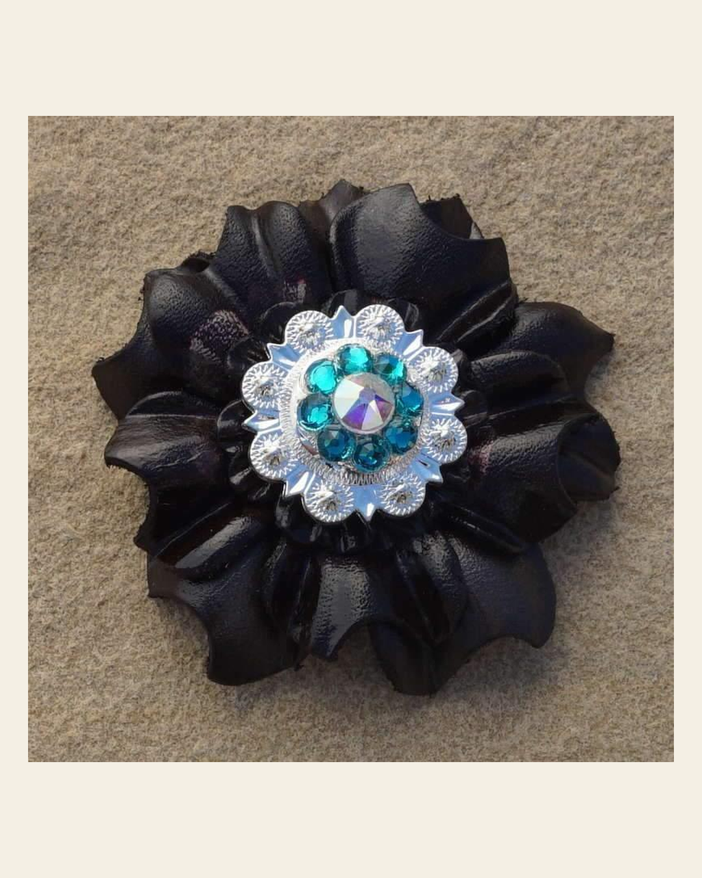 Black Carnation Flower With Bright Silver Teal & AB 1" Concho on a warm cream background