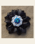 Black Carnation Flower With Bright Silver Teal and Capri 1" Concho on a warm cream background