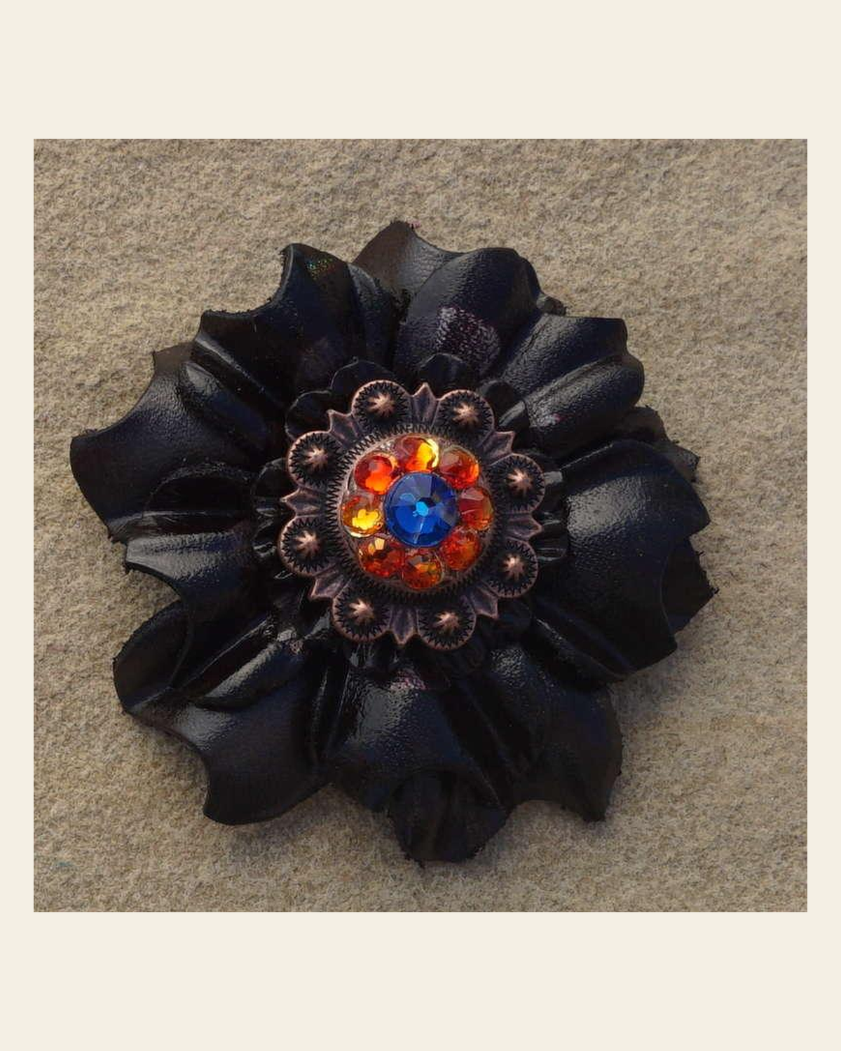 Black Carnation Flower With Copper Capri and Fire Opal 1" Concho on a warm cream background