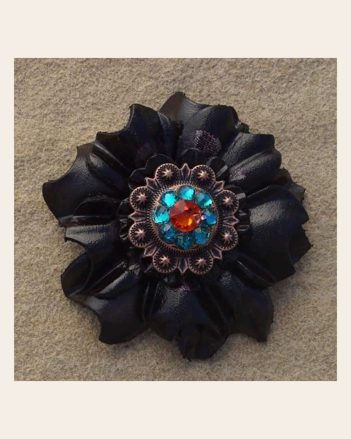 Black Carnation Flower With Copper Fire Opal & Teal 1" Concho on a warm cream background