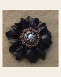 Black Carnation Flower With Copper Jet and AB 1" Concho on a warm cream background