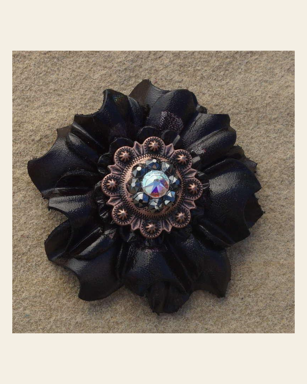 Black Carnation Flower With Copper Jet and AB 1" Concho on a warm cream background