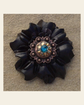 Black Carnation Flower With Copper Teal & Champagne 1" Concho on a warm cream background