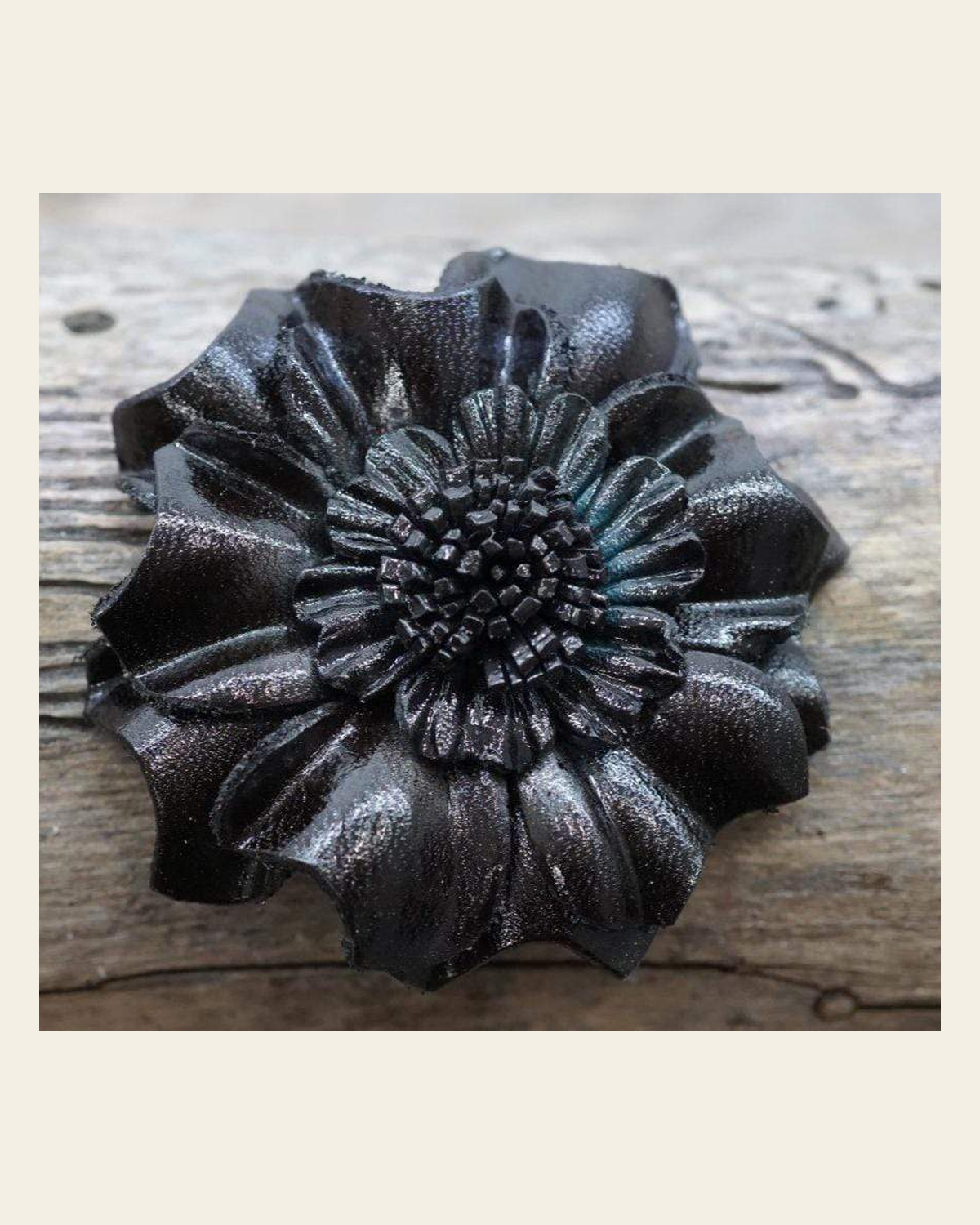 Black Carnation Leather Flower on a warm cream background