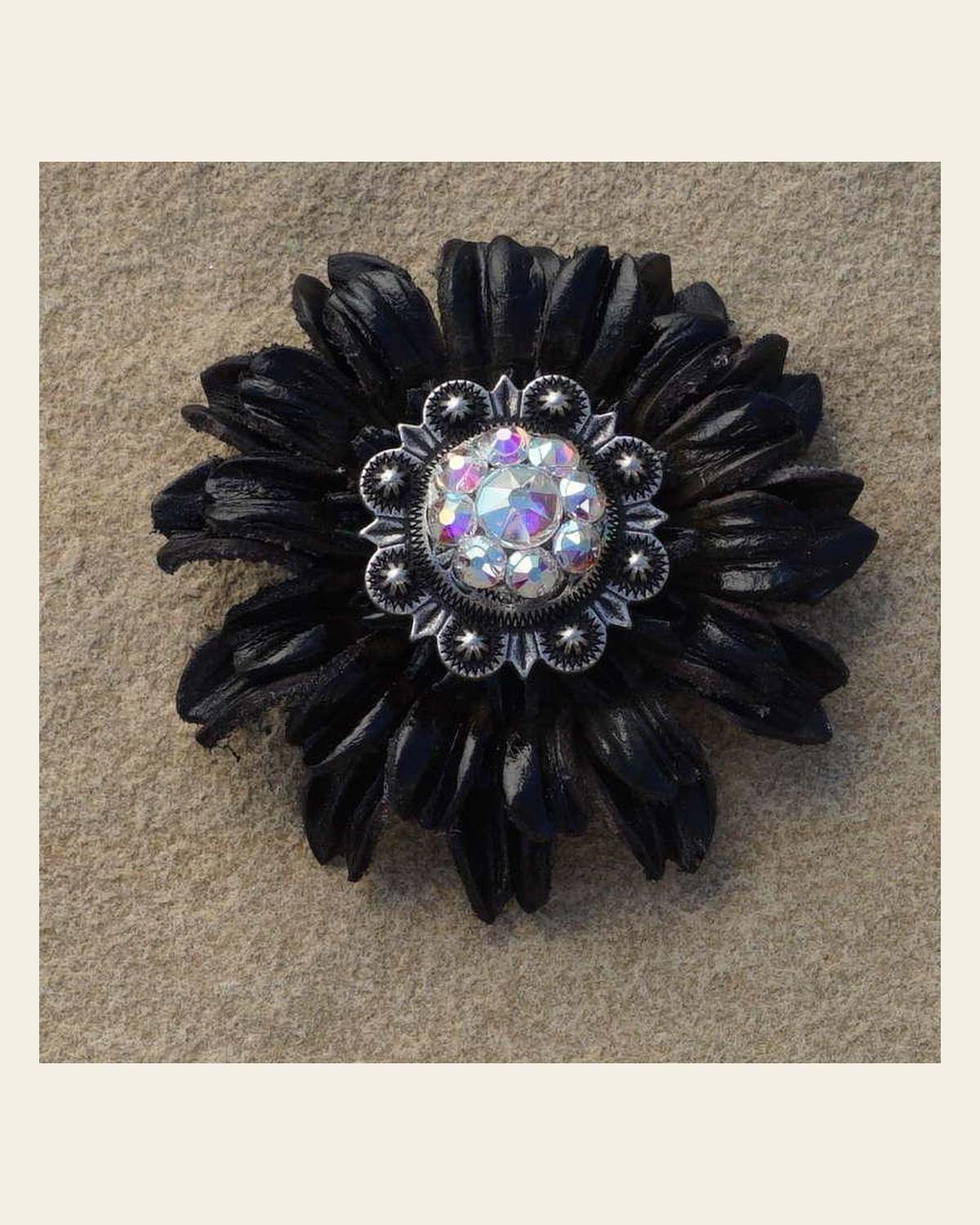 Black Daisy Flower With Antique Silver AB 1" Concho on a warm cream background