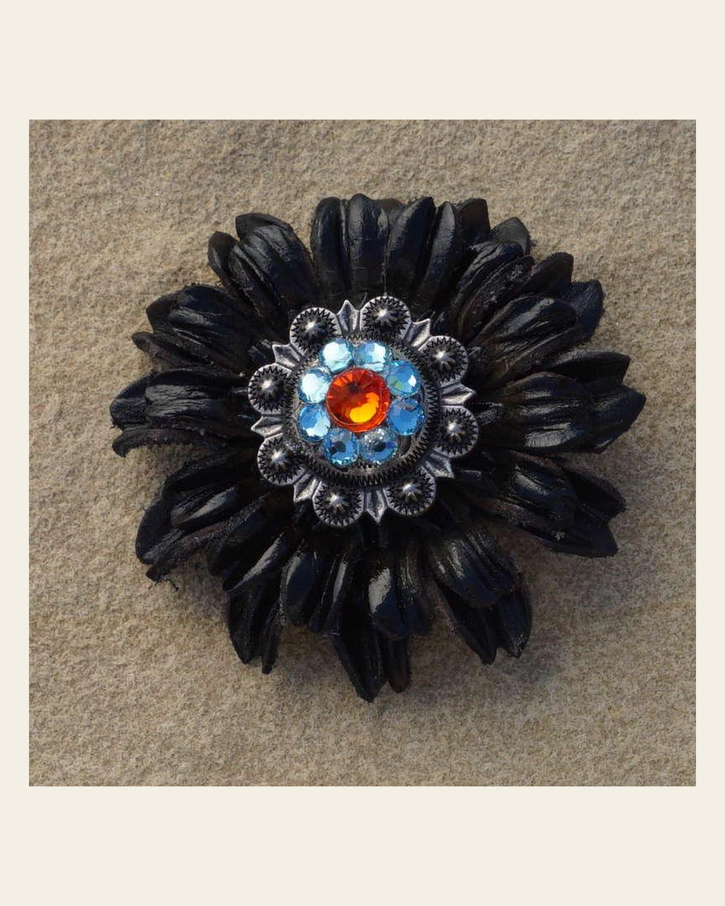 Black Daisy Flower With Antique Silver Fire Opal and Aqua 1" Concho on a warm cream background