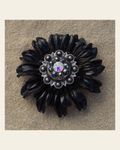 Black Daisy Flower With Antique Silver Jet and AB 1" Concho on a warm cream background