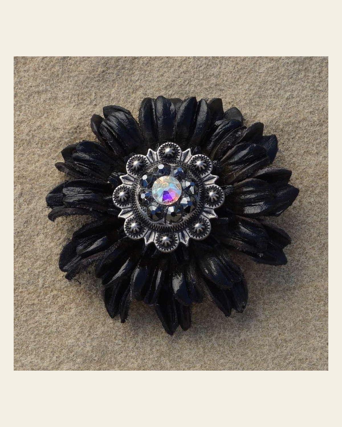 Black Daisy Flower With Antique Silver Jet and AB 1" Concho on a warm cream background