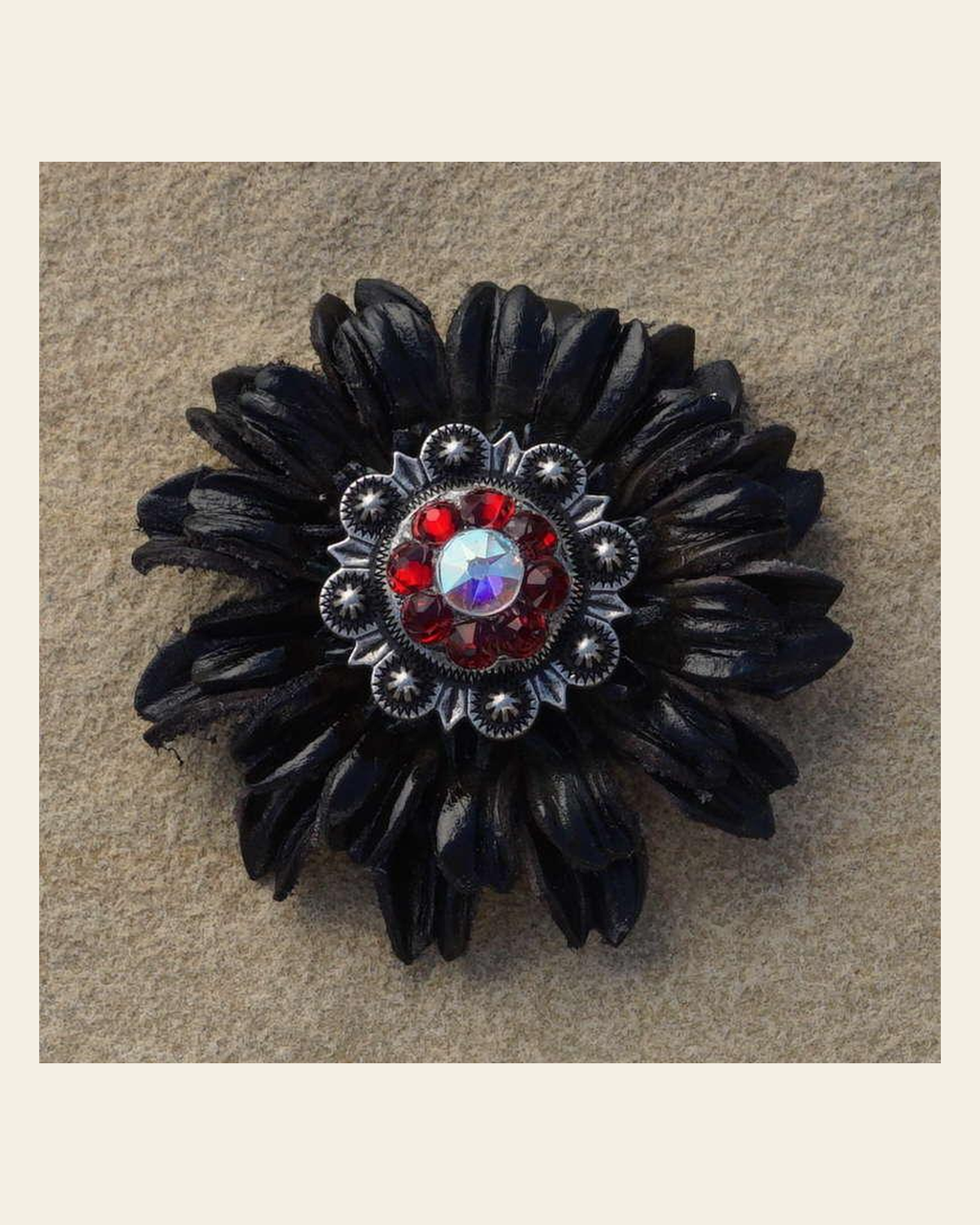 Black Daisy Flower With Antique Silver Ruby and AB 1" Concho on a warm cream background