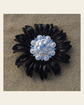 Black Daisy Flower With Bright Silver Clear 1" Concho on a warm cream background