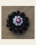 Black Daisy Flower With Bright Silver Fuchsia and AB 1" Concho on a warm cream background