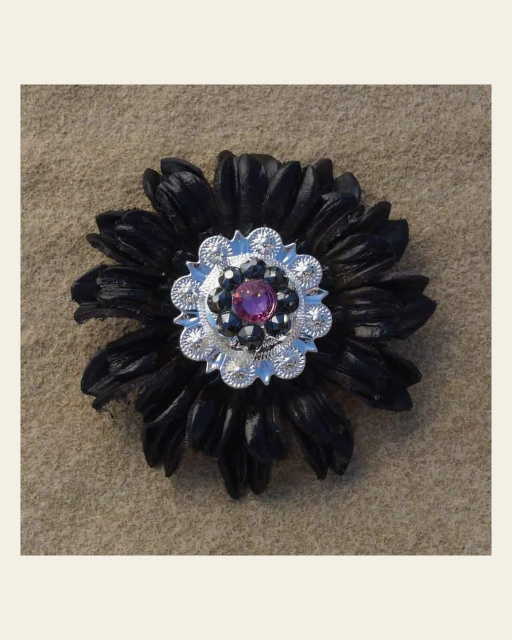 Black Daisy Flower With Bright Silver Pink & Jet 1" Concho on a warm cream background