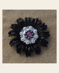 Black Daisy Flower With Bright Silver Pink & Jet 1" Concho on a warm cream background
