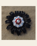 Black Daisy Flower With Bright Silver Ruby and AB 1" Concho on a warm cream background