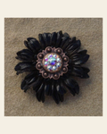 Black Daisy Flower With Copper AB 1" Concho on a warm cream background