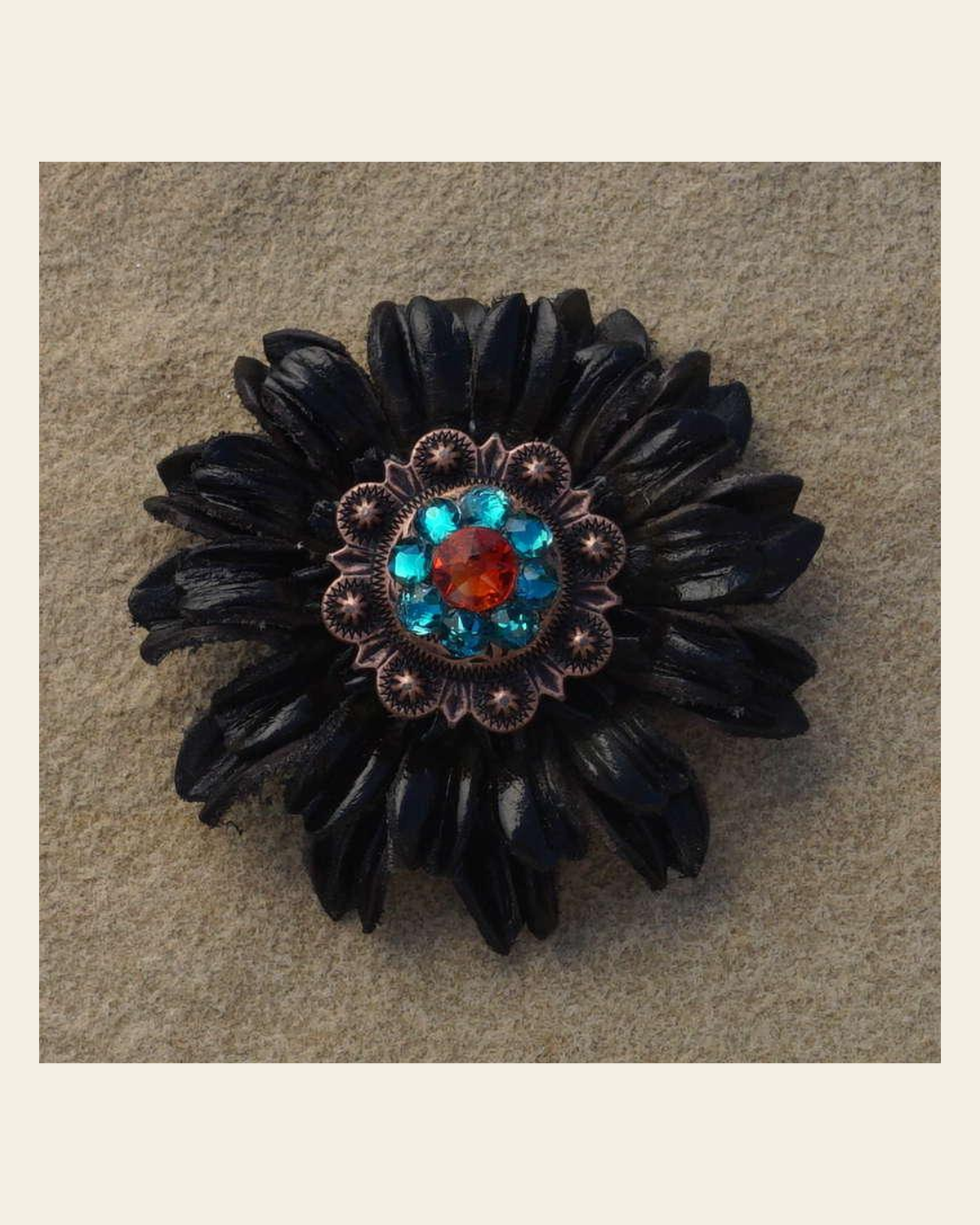 Black Daisy Flower With Copper Fire Opal and Teal 1" Concho on a warm cream background