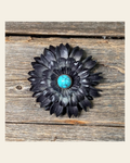 Black Daisy Flower With Round Turquoise Cabochon on a warm cream background